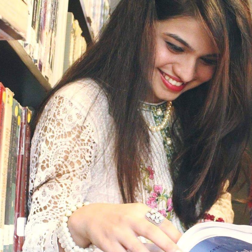 Annie in a happy mood, reading a humorous book