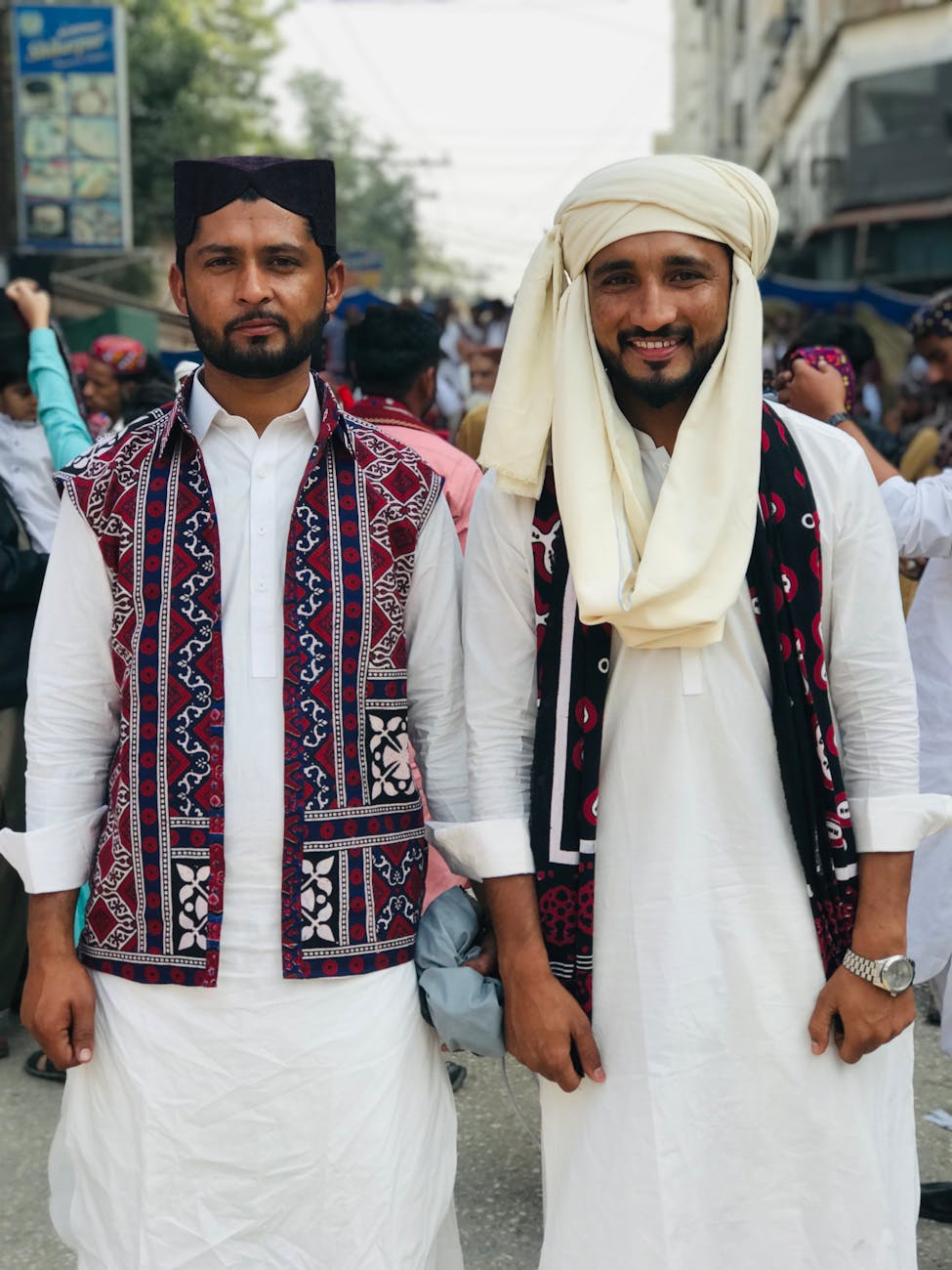 smiling men in traditional clothing